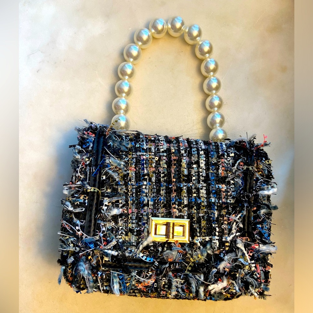 Designer inspired colored tweed with silver, and pearl strap handle.